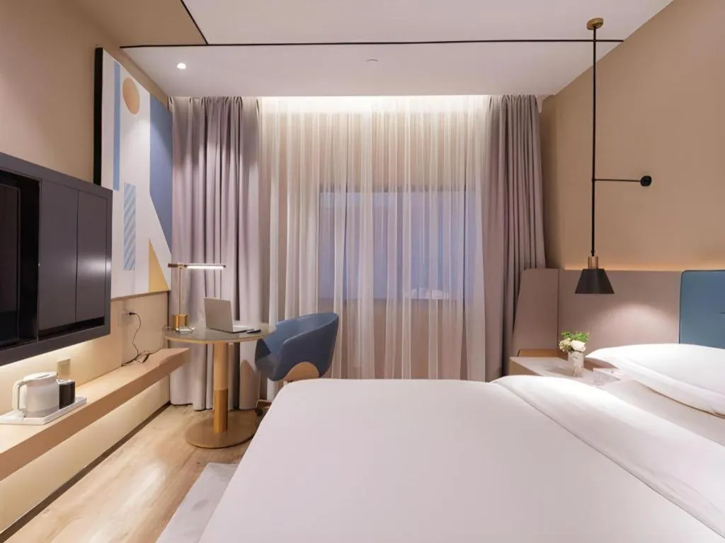 Bed in ZMAX Hotels Shenzhen Lianhuacun Metro Station