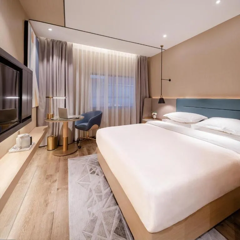 Bed in ZMAX Hotels Shenzhen Lianhuacun Metro Station