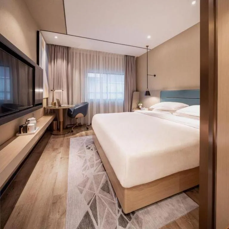 Bed in ZMAX Hotels Shenzhen Lianhuacun Metro Station