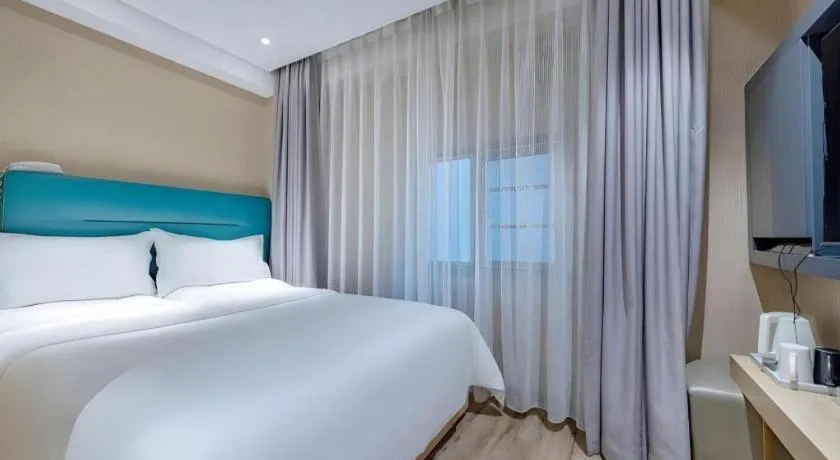 Bed in ZMAX Hotels Shenzhen Lianhuacun Metro Station