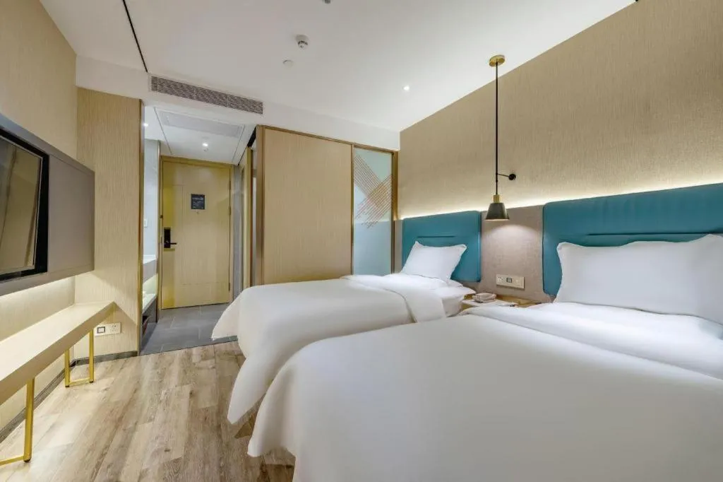 Bed in ZMAX Hotels Shenzhen Lianhuacun Metro Station