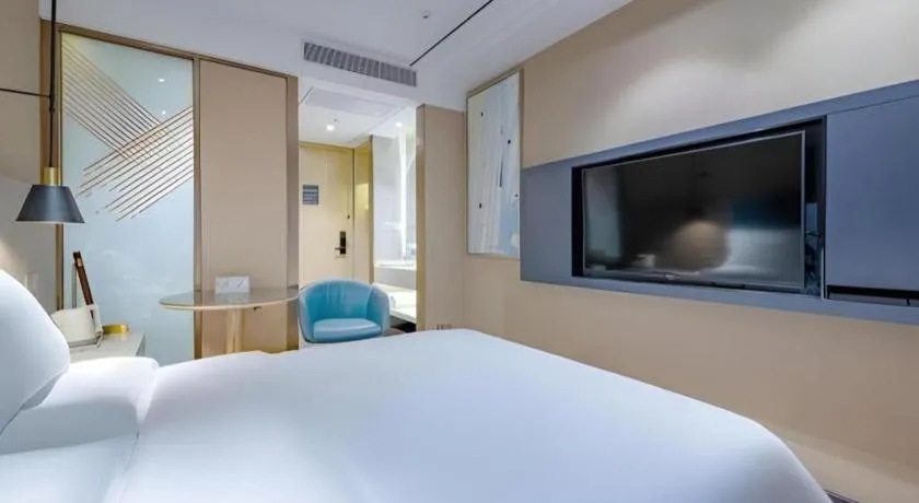 Bed in ZMAX Hotels Shenzhen Lianhuacun Metro Station