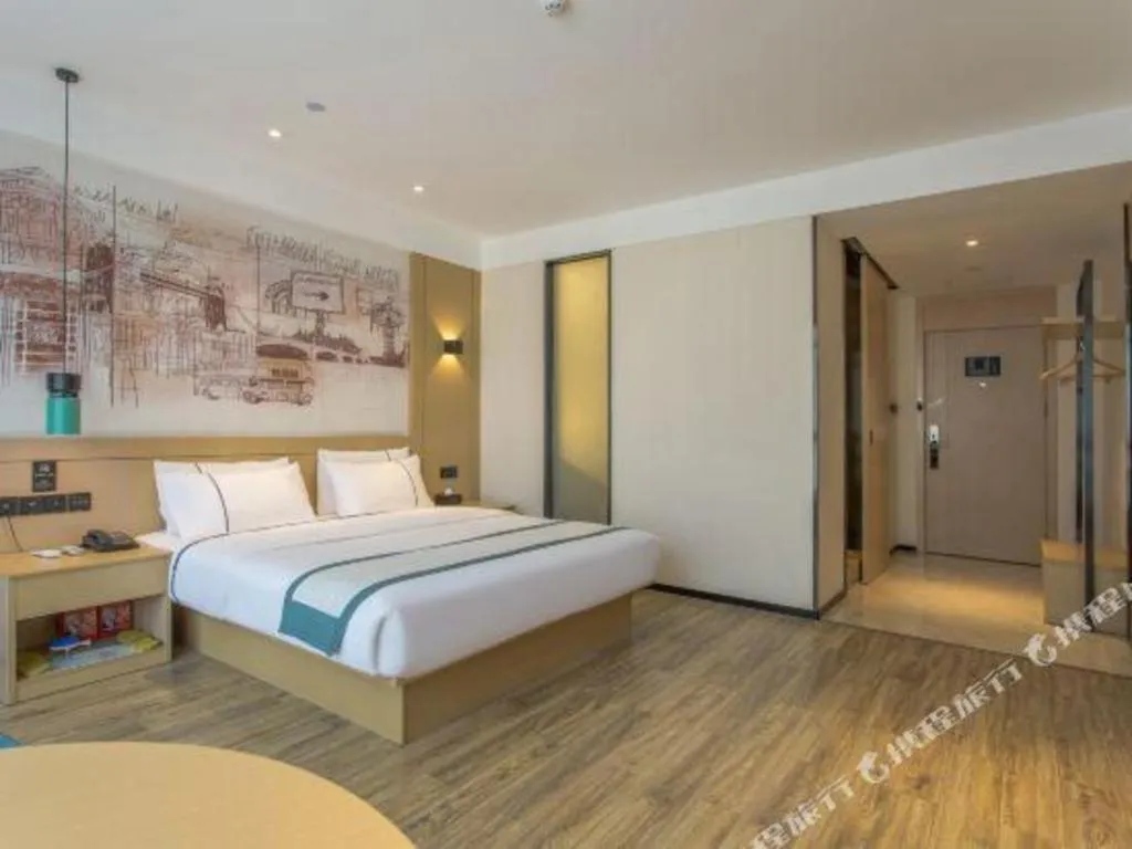 Bed in City Comfort Inn Dongguan Wangniudun