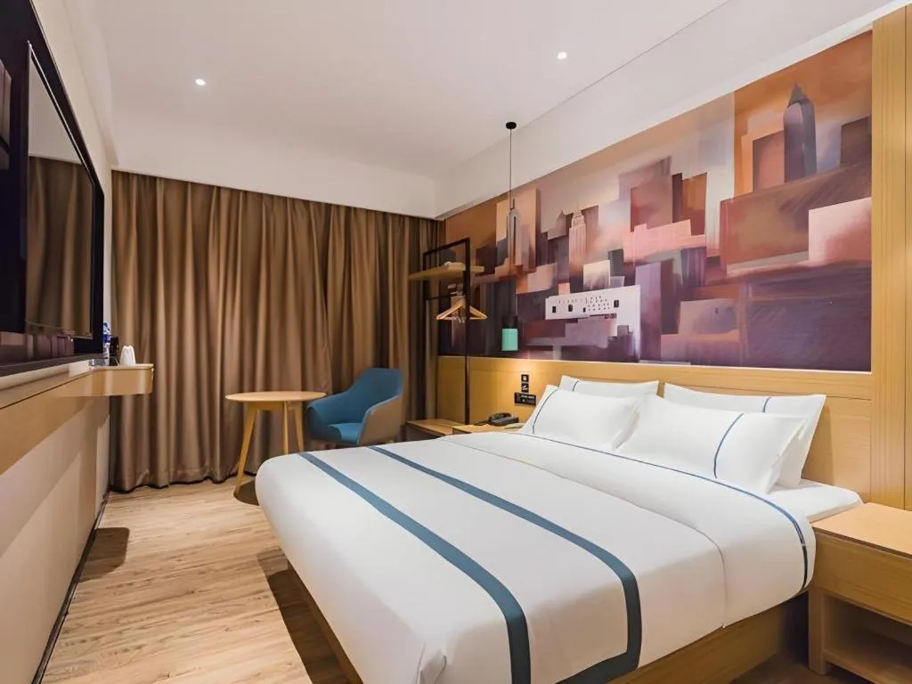 Bed in City Comfort Inn Dongguan Wangniudun