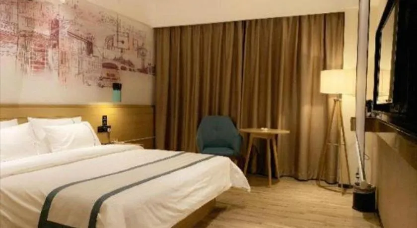 Bed in City Comfort Inn Dongguan Wangniudun