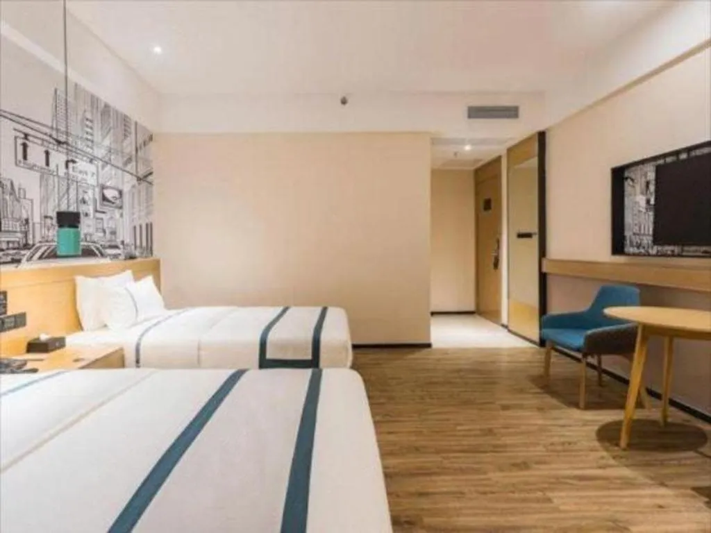 Bed in City Comfort Inn Dongguan Wangniudun