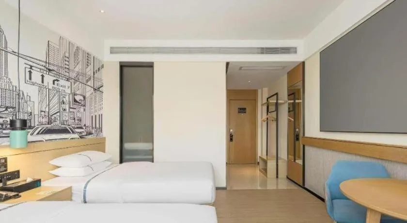 Bed in City Comfort Inn Dongguan Wangniudun