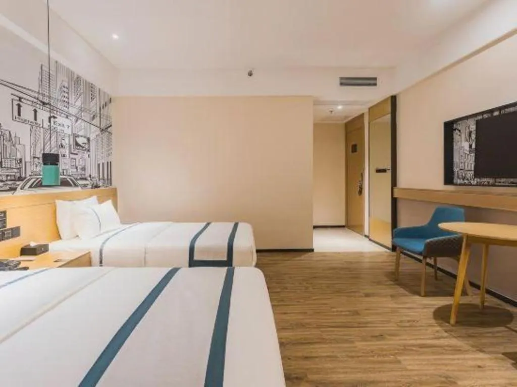 Bed in City Comfort Inn Dongguan Wangniudun