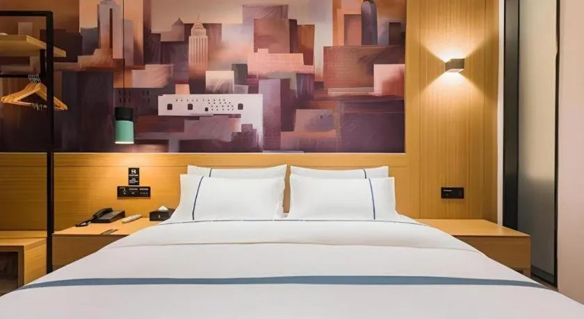 Bed in City Comfort Inn Dongguan Wangniudun