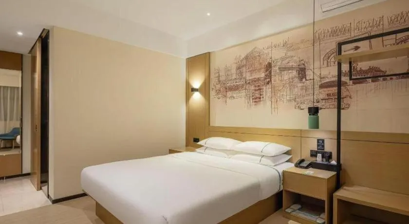Bed in City Comfort Inn Dongguan Wangniudun