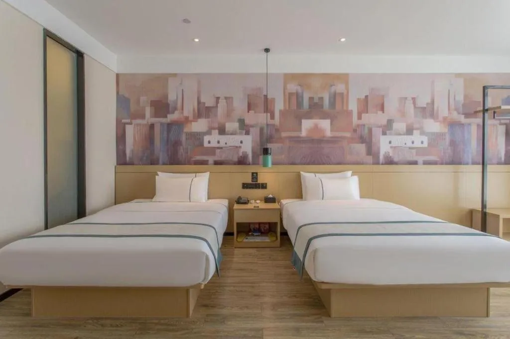 Bed in City Comfort Inn Dongguan Wangniudun