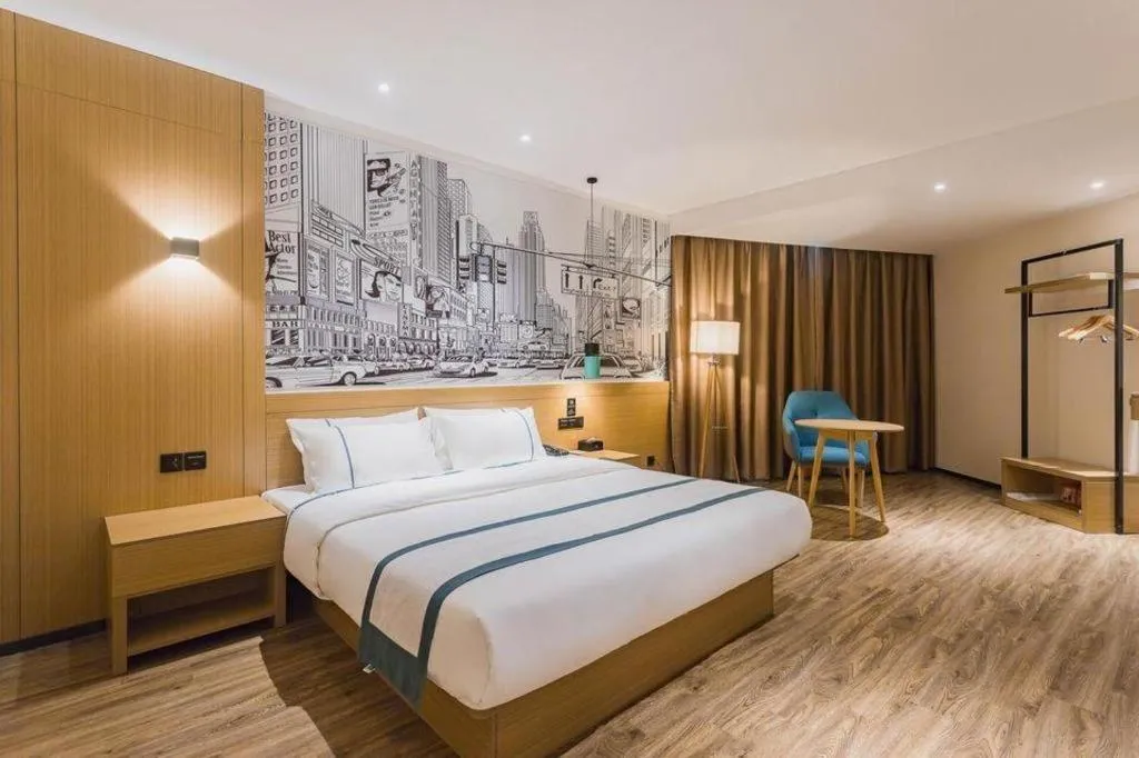 Bed in City Comfort Inn Dongguan Wangniudun