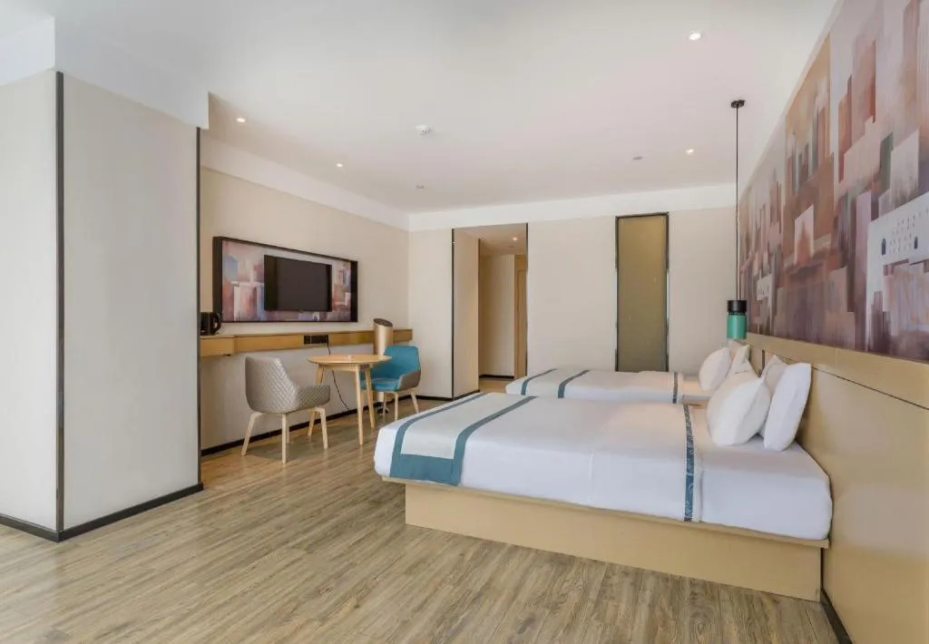 Bed in City Comfort Inn Dongguan Wangniudun