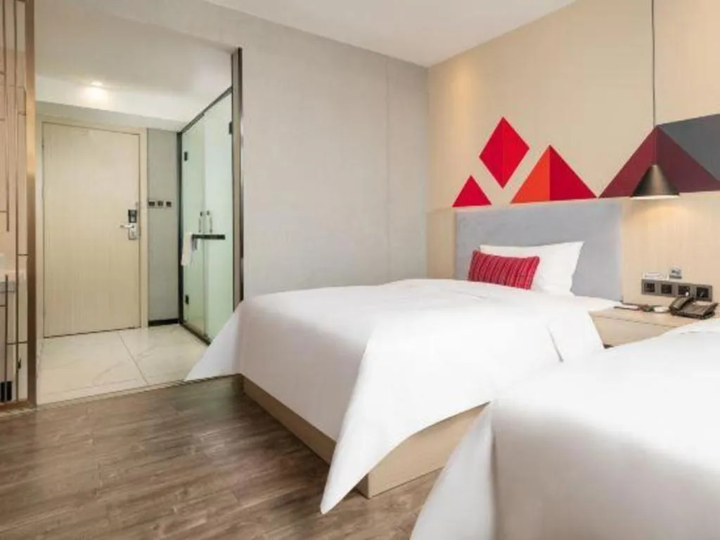Bed in Borrman Hotel Dongguan Houjie Wanda Plaza Liaoxia Metro Station