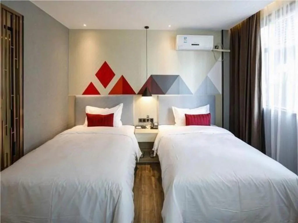 Bed in Borrman Hotel Dongguan Houjie Wanda Plaza Liaoxia Metro Station