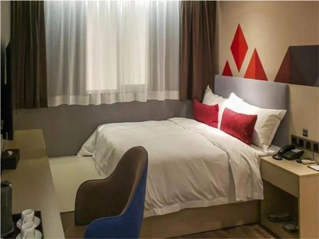 Bed in Borrman Hotel Dongguan Houjie Wanda Plaza Liaoxia Metro Station