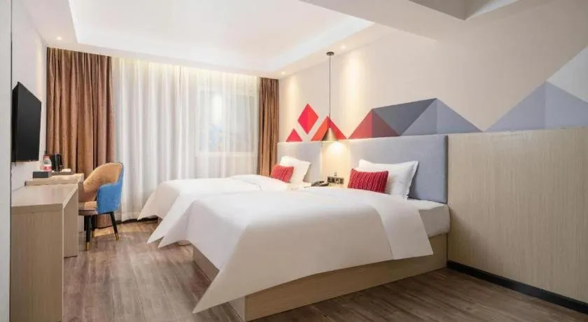 Bed in Borrman Hotel Dongguan Houjie Wanda Plaza Liaoxia Metro Station