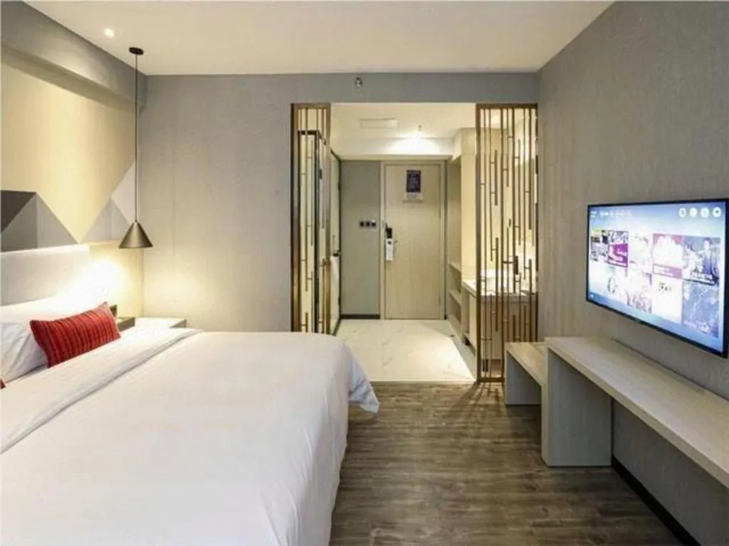 Bed in Borrman Hotel Dongguan Houjie Wanda Plaza Liaoxia Metro Station