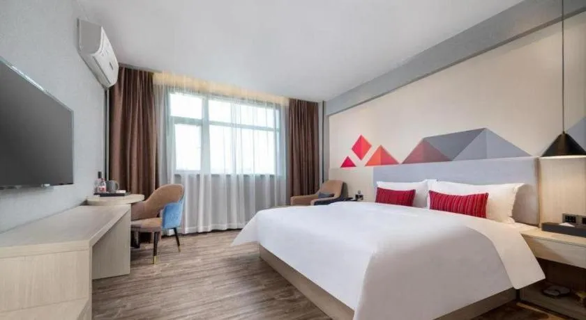 Bed in Borrman Hotel Dongguan Houjie Wanda Plaza Liaoxia Metro Station