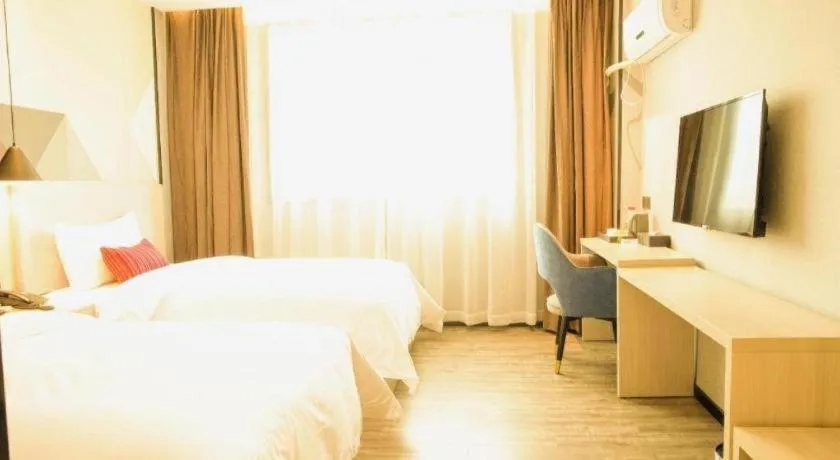 Bed in Borrman Hotel Dongguan Houjie Wanda Plaza Liaoxia Metro Station