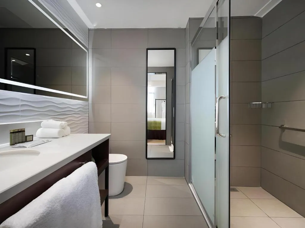 Bed in Campanile Hotel Shenzhen Bay Convention and Exhibition Center