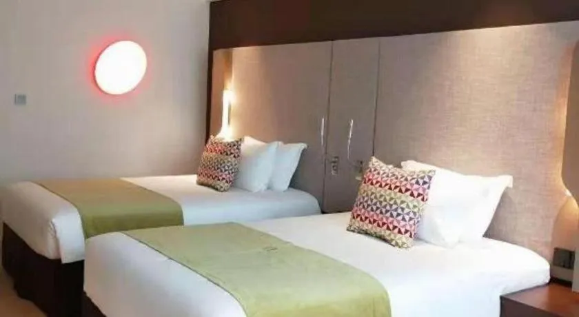 Bed in Campanile Hotel Shenzhen Bay Convention and Exhibition Center