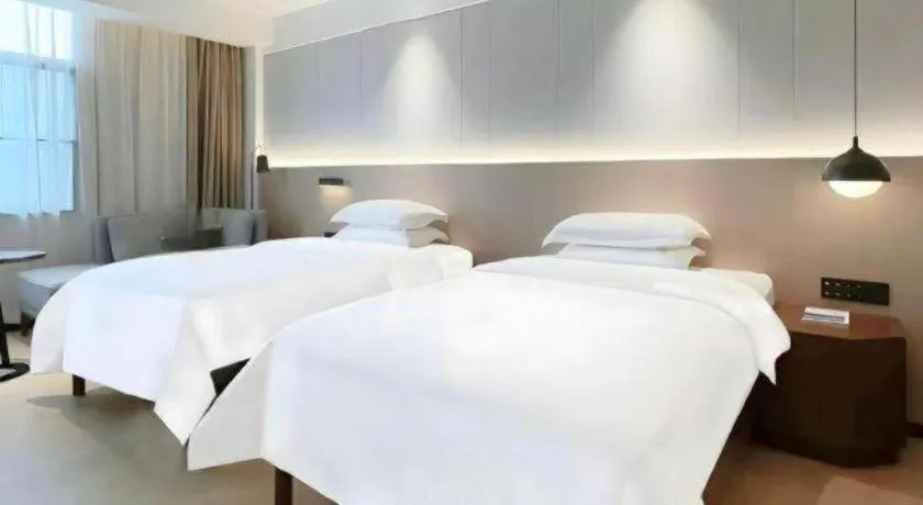 Bed in Campanile Hotel Shenzhen Bay Convention and Exhibition Center