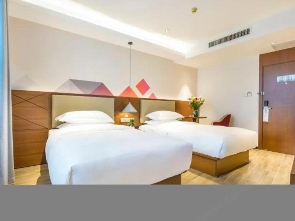 Bed in Borrman Hotel Guangzhou Southern Hospital Meihuayuan Metro Station