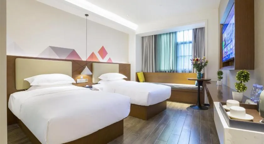 Bed in Borrman Hotel Guangzhou Southern Hospital Meihuayuan Metro Station