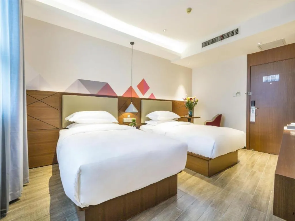 Bed in Borrman Hotel Guangzhou Southern Hospital Meihuayuan Metro Station