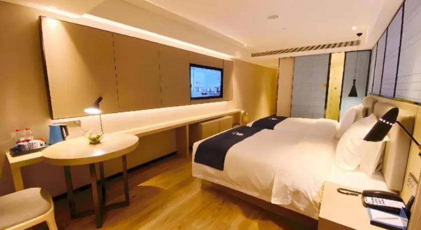 Bed in Echarm Hotel Shenzhen World Exhibition and Convention Center