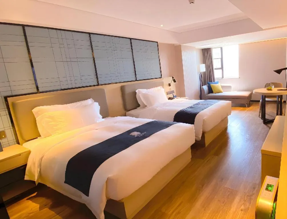 Bed in Echarm Hotel Shenzhen World Exhibition and Convention Center