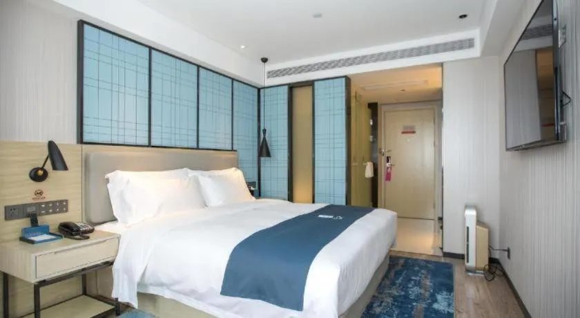 Bed in Echarm Hotel Shenzhen World Exhibition and Convention Center