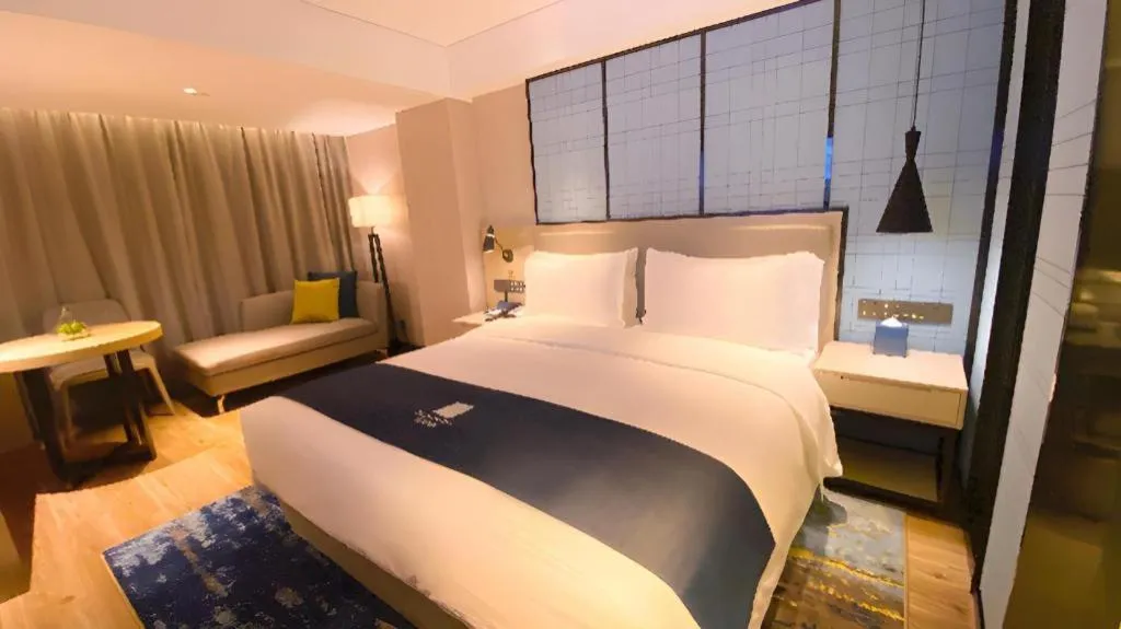 Bed in Echarm Hotel Shenzhen World Exhibition and Convention Center