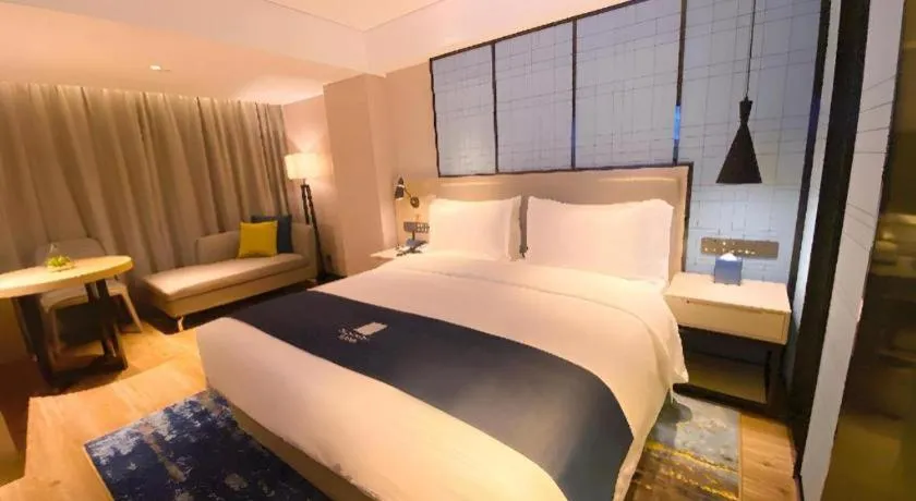 Bed in Echarm Hotel Shenzhen World Exhibition and Convention Center