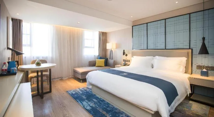 Bed in Echarm Hotel Shenzhen World Exhibition and Convention Center