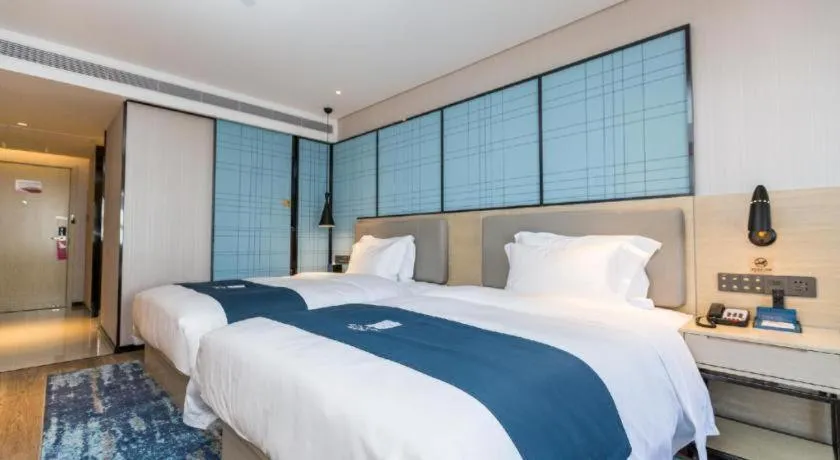 Bed in Echarm Hotel Shenzhen World Exhibition and Convention Center