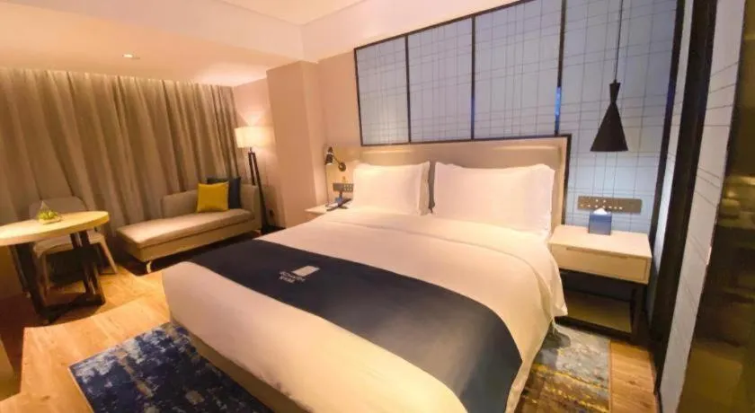 Bed in Echarm Hotel Shenzhen World Exhibition and Convention Center