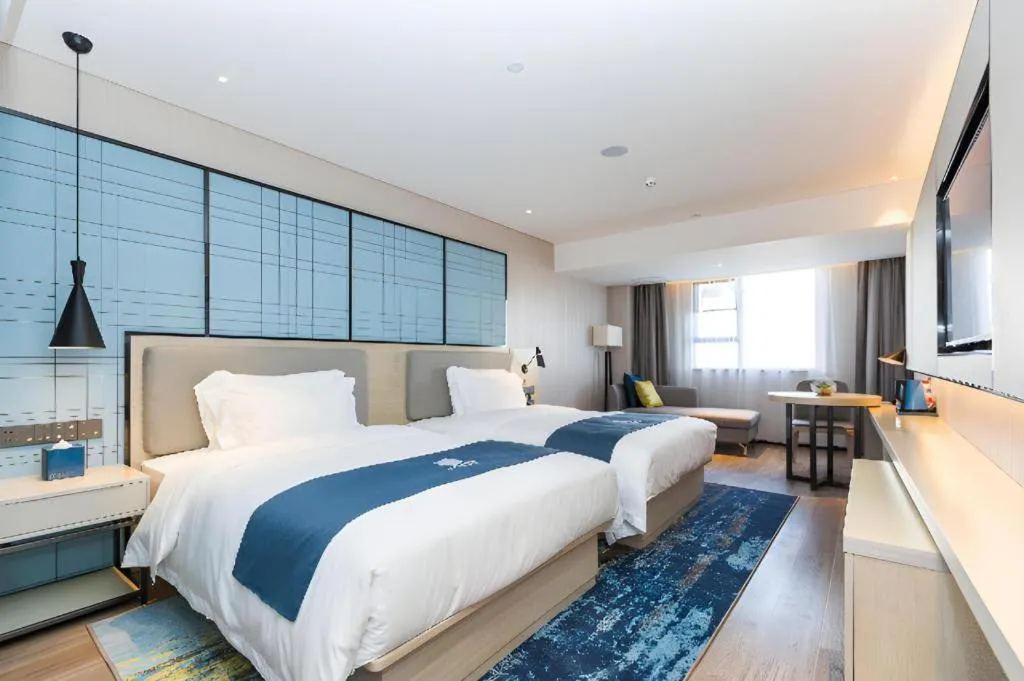 Bed in Echarm Hotel Shenzhen World Exhibition and Convention Center