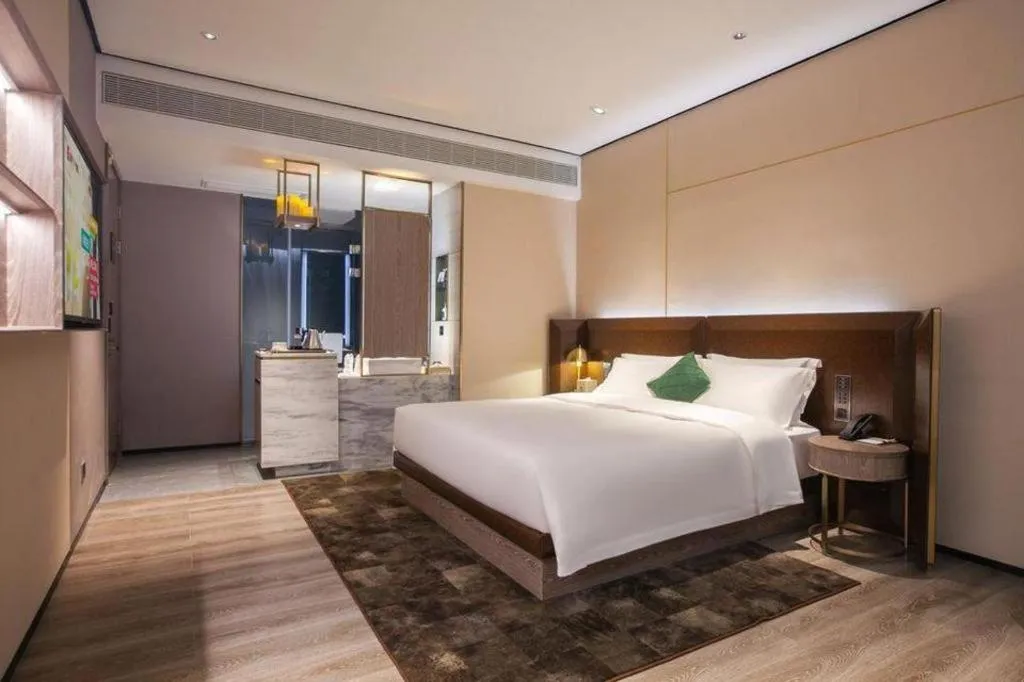 Bed in Echarm Plus Hotel Wuhan Wenhua Boulevard Dahualing Subway Statiom