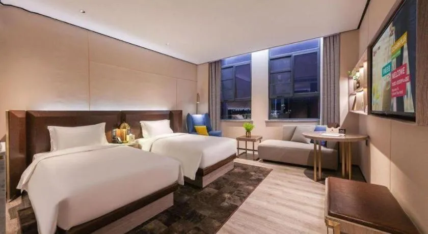 Bed in Echarm Plus Hotel Wuhan Wenhua Boulevard Dahualing Subway Statiom