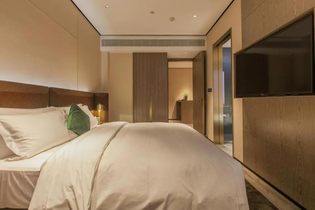 Bed in Echarm Plus Hotel Wuhan Wenhua Boulevard Dahualing Subway Statiom