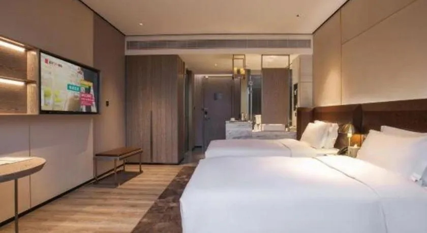 Bed in Echarm Plus Hotel Wuhan Wenhua Boulevard Dahualing Subway Statiom