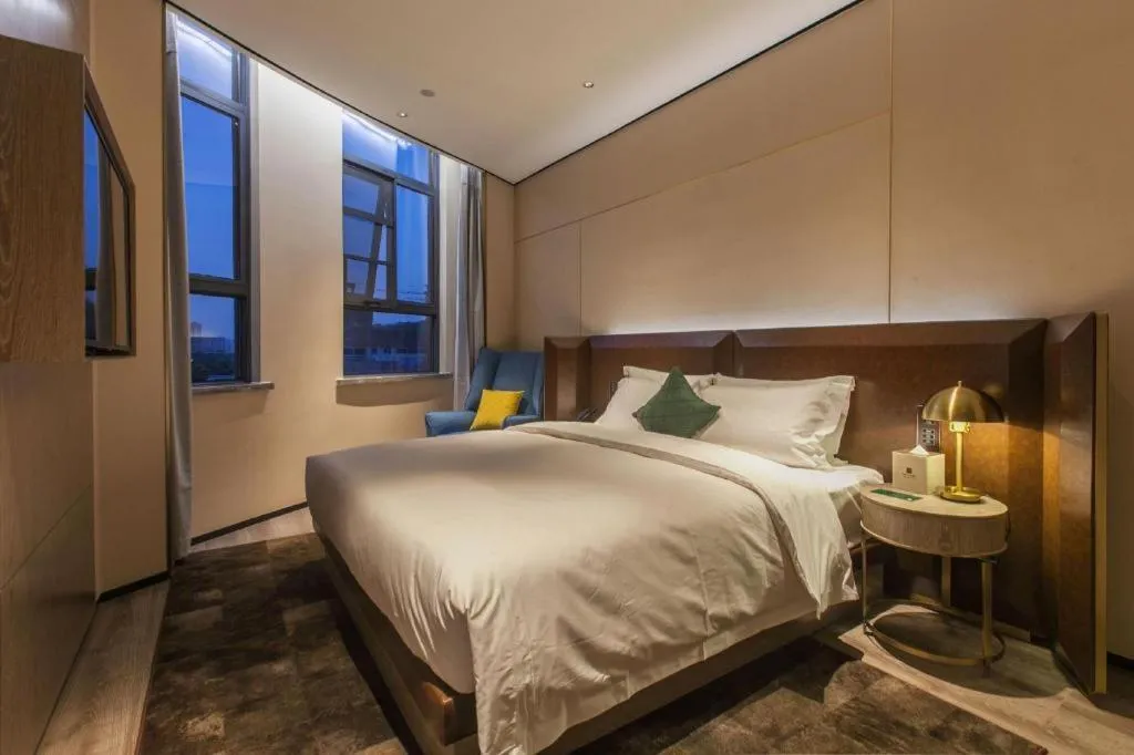 Bed in Echarm Plus Hotel Wuhan Wenhua Boulevard Dahualing Subway Statiom