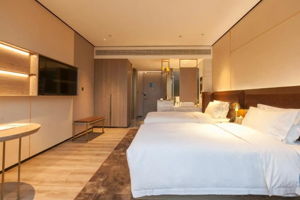 Bed in Echarm Plus Hotel Wuhan Wenhua Boulevard Dahualing Subway Statiom