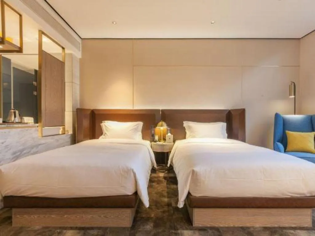 Bed in Echarm Plus Hotel Wuhan Wenhua Boulevard Dahualing Subway Statiom
