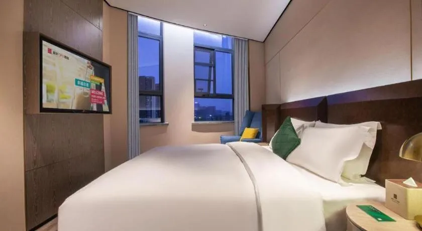Bed in Echarm Plus Hotel Wuhan Wenhua Boulevard Dahualing Subway Statiom