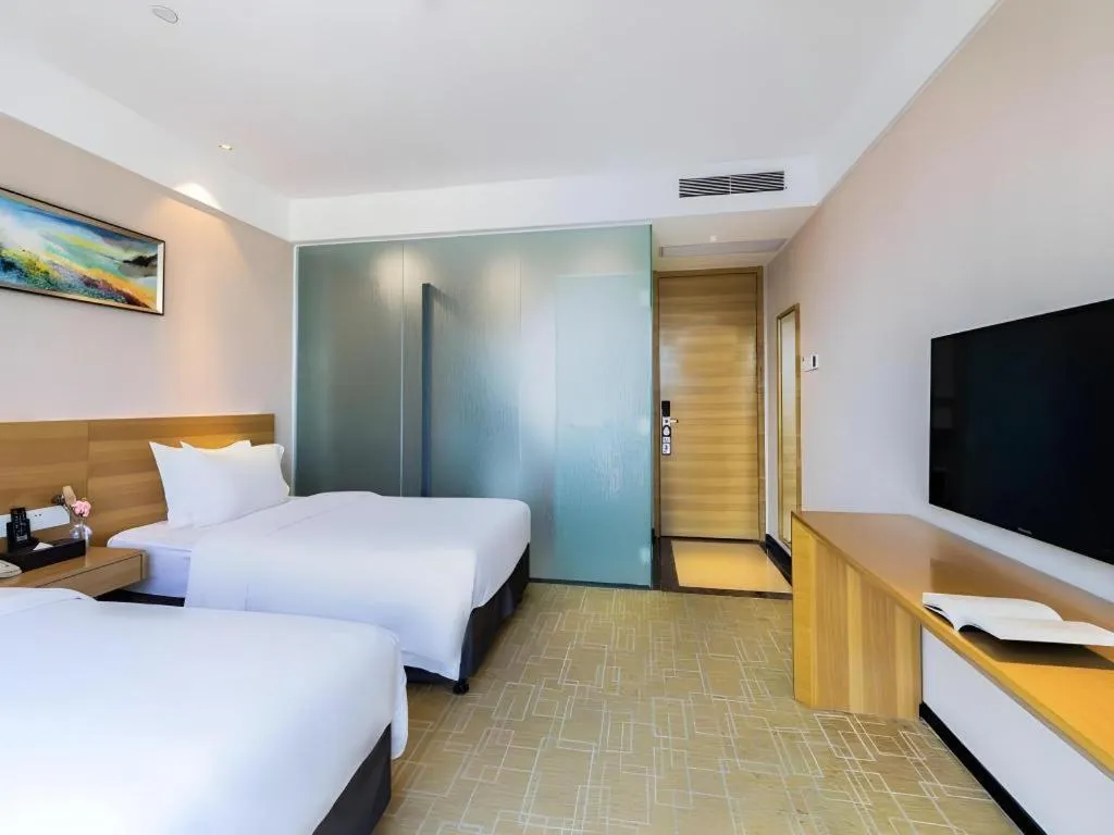 Bed in GreenTree Alliance Hotel Shenzhen Yantian District Dameisha