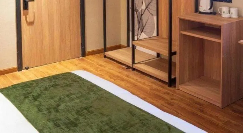 Bed in GreenTree Inn Express Suzhou Luzhi Ancient Town Scenic Area Xiaoshi Road