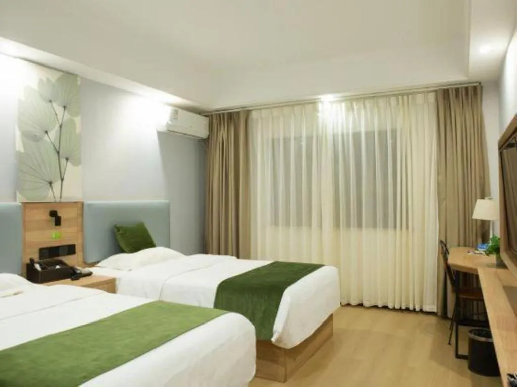 Bed in GreenTree Inn Express Hainan Haikou Haixiu Zhong Road